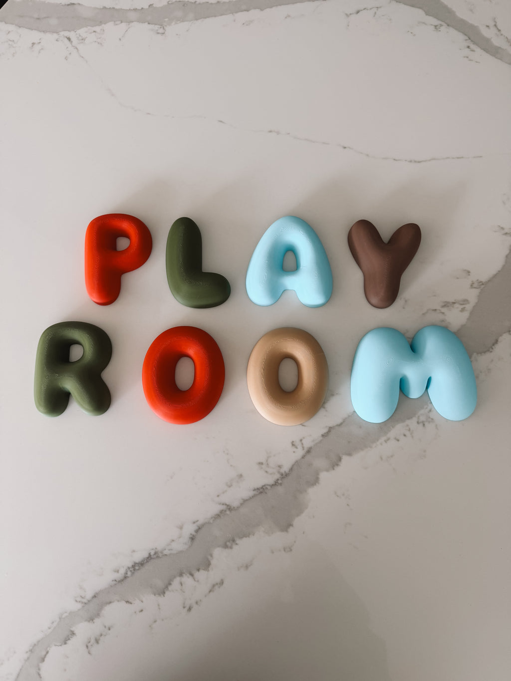 3D printed bubble letters made in NZ bright and neutral colour combination for a playroom